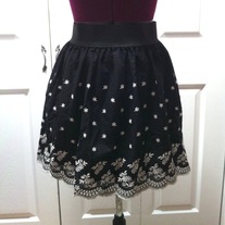 In M & L - black off white flower embroidered mini scallop border skirt